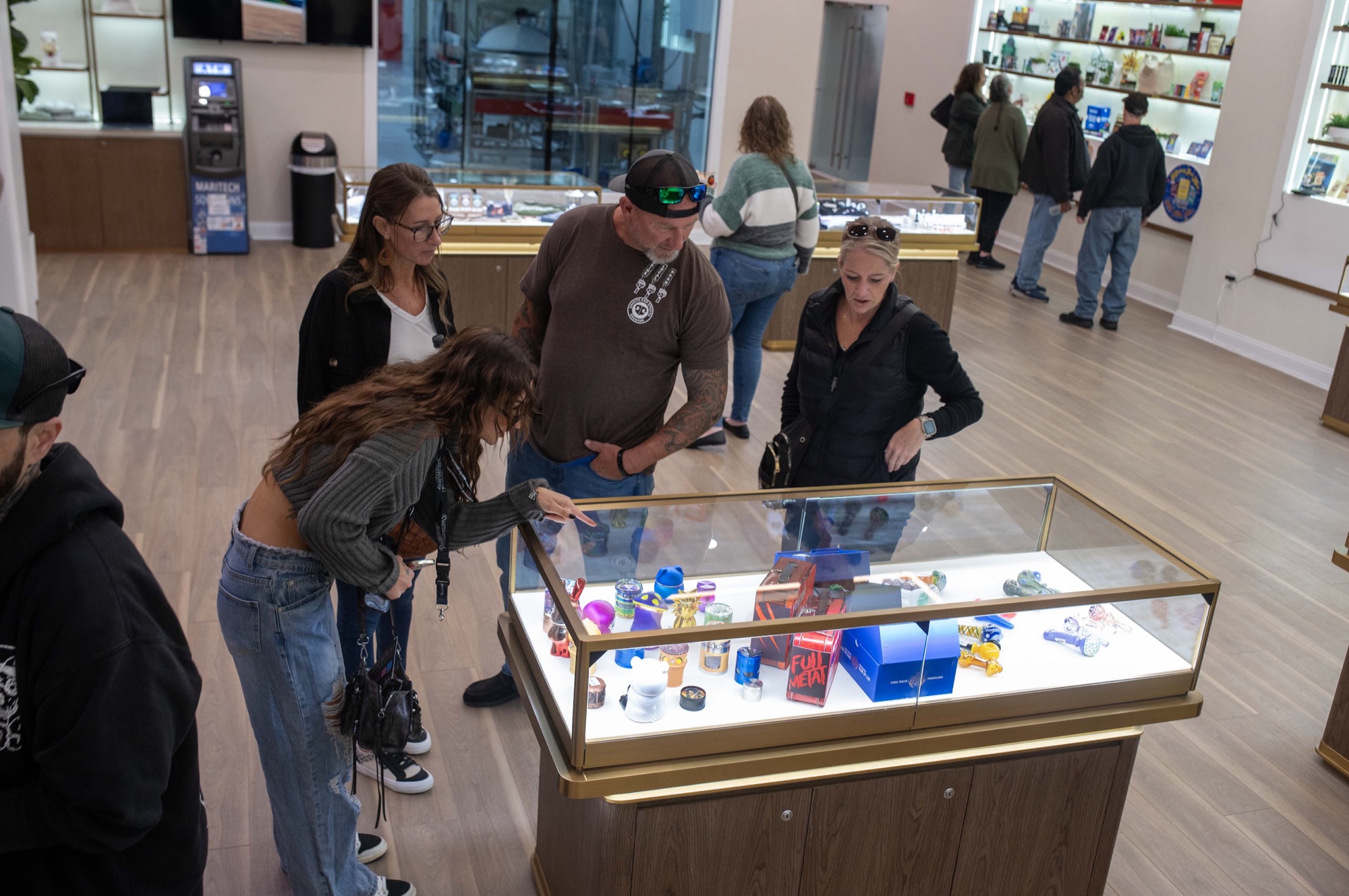 Customers looking at a display case inside Red Oak Dispensary, Absecon